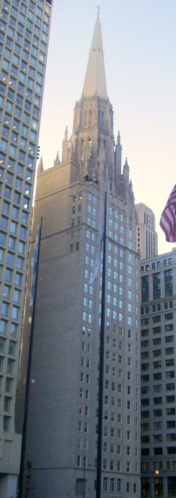 The Gothic spire of the Chicago Temple over Daley Plaza
