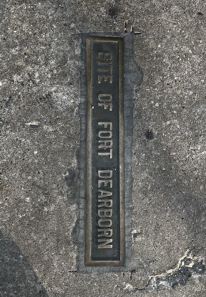 Bronze marker for Fort Dearborn set into the pavement at Michigan and Wacker