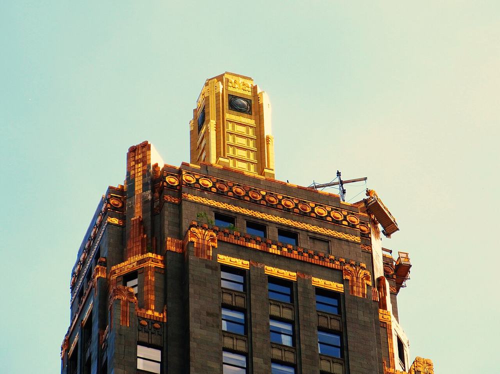The dark green terra cotta and gold top of the Carbide and Carbon Building