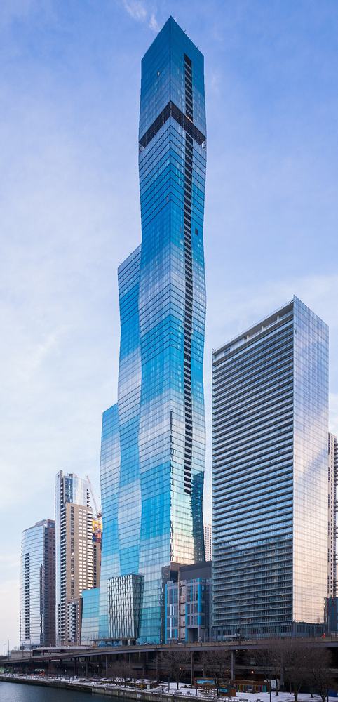 The three stepped blue-green stems of the St. Regis Chicago tower